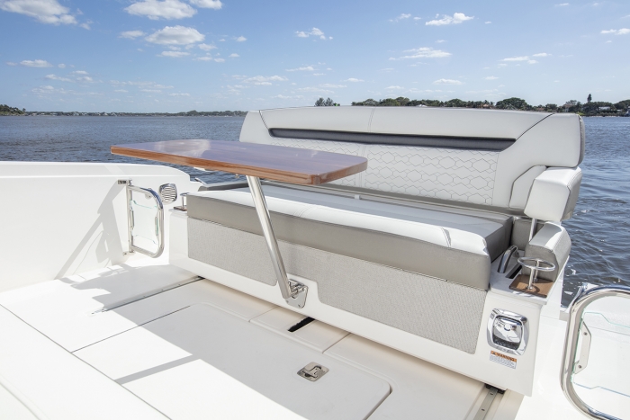 Tiara Yachts 34 LS | Aft Sliding Bench Seat with High-Gloss Teak table