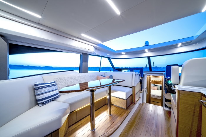 Tiara Yachts 48 LE | Portside Lounge and Dinette | Upholstery: Whitewater | Fabric: Tangerine Bay