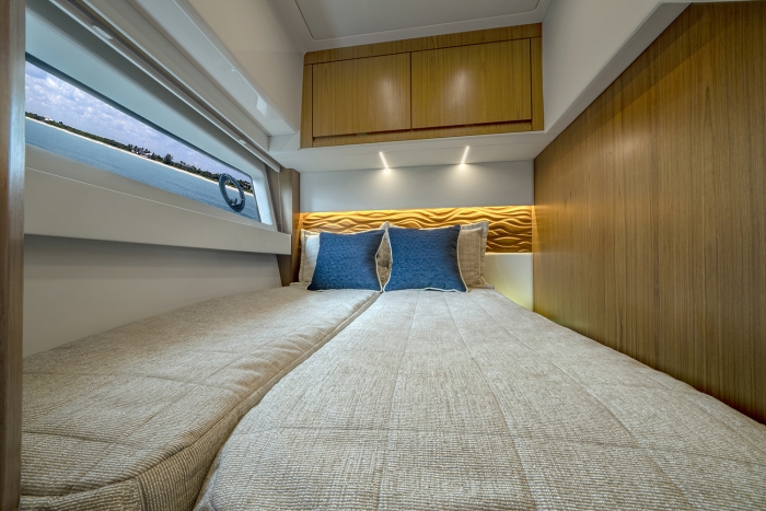 Tiara Yachts EX 60 | Third stateroom showing full bed configuration 