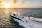 43 LS running with view of portside hull as sun sets over Miami