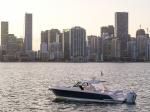 43 LS sitting idle, facing to port with Miami skyline backdrop