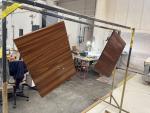 Solid teak table surfaces going thru high gloss varnish process