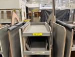 Some of your varnished cabin panels are organized onto carts to go to assembly