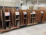Cut cabin, seating and cabinet parts are being organized onto carts before they go to assembly