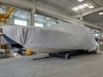 After a final cleaning and inspection, the boat is wrapped in a protective shipping cover